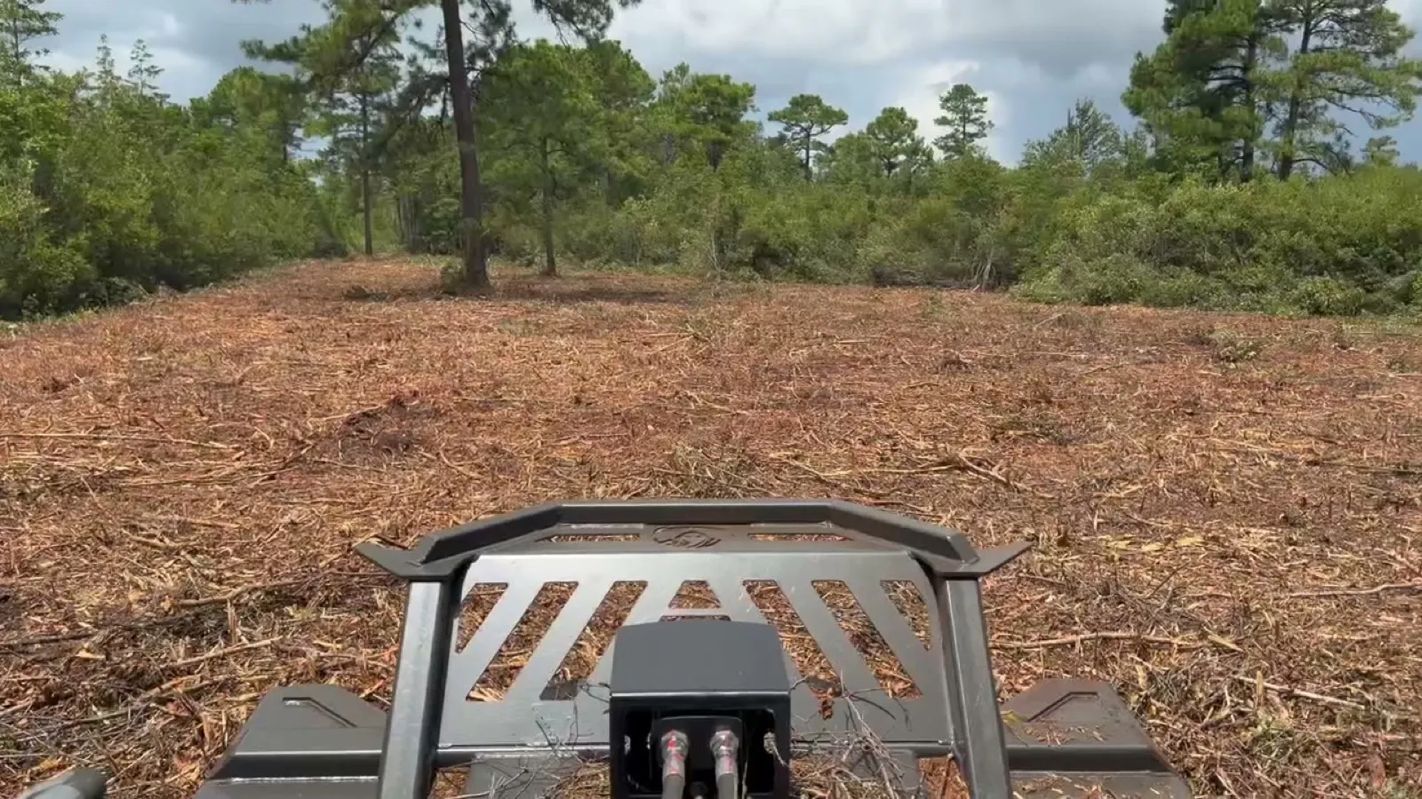 Freshly bush hogged field in coastal South Carolina seen from the operator seat