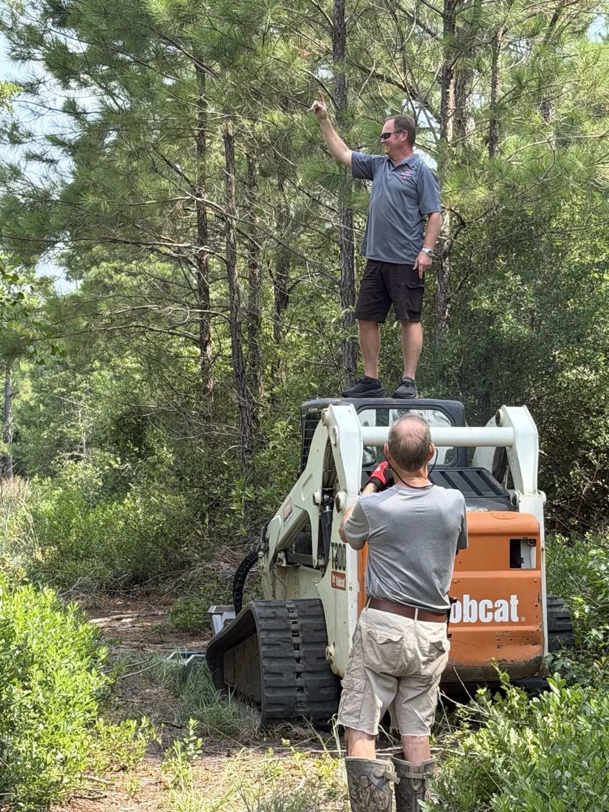 The owner up on the Bobcat T300 between passes